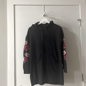 xs black long sweater with rosé embroidered on the arms
